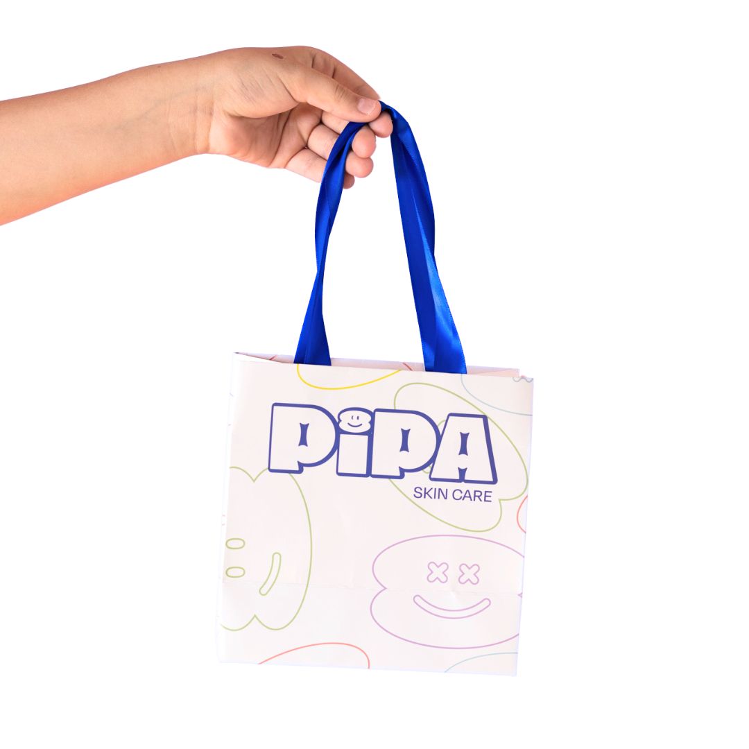 Pipa gift bag with blue ribbon handles, skincare products not included.