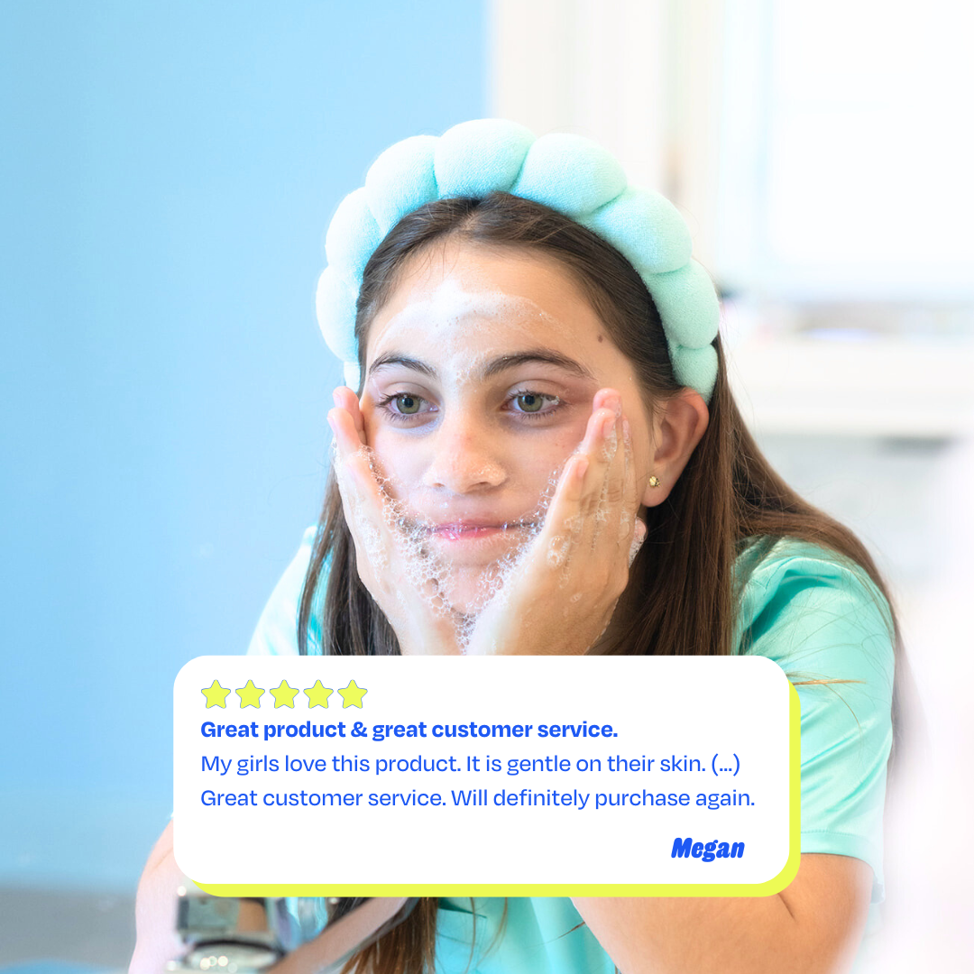 Tween girl using Squeaky Clean facial cleanser with a bubbly lather on her face, wearing a blue headband.