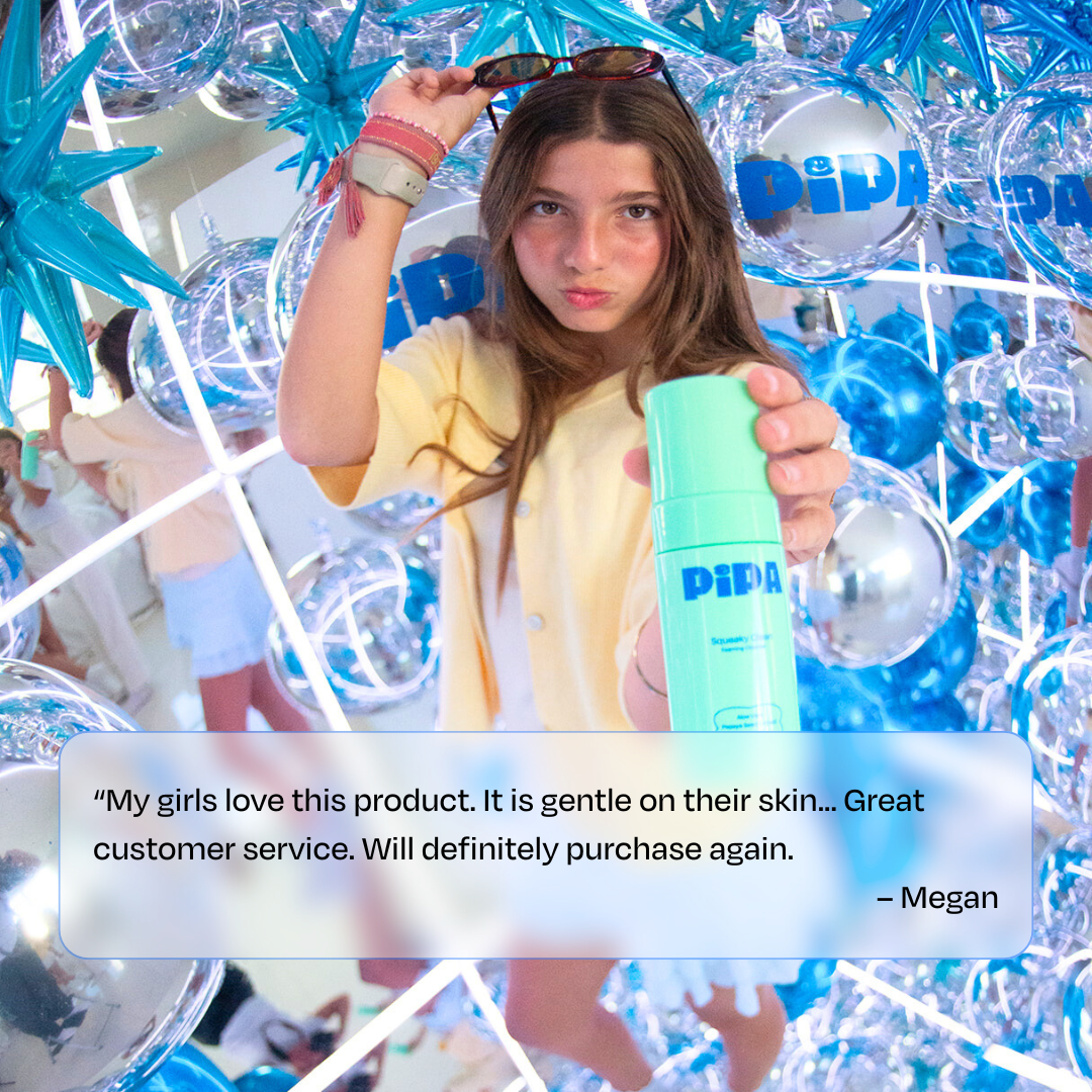 Tween girl holding Squeaky Clean facial cleanser with festive blue and silver decorations background