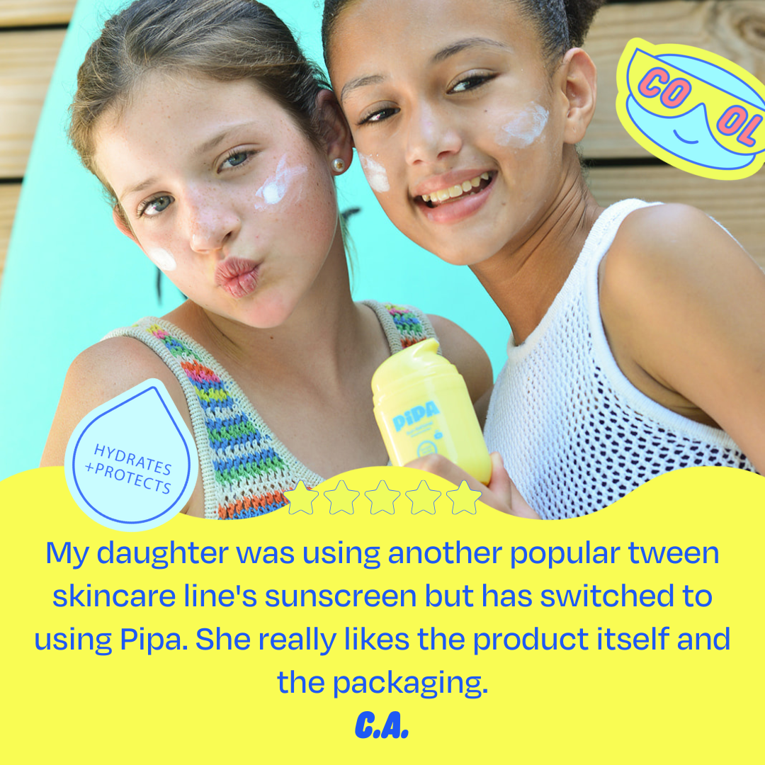 Two young girls with sunscreen on cheeks and a skincare product, smiling outdoors.